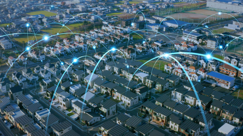 Vista aerea di un quartiere con pannelli solari collegati da linee luminose a rappresentare una comunità energetica